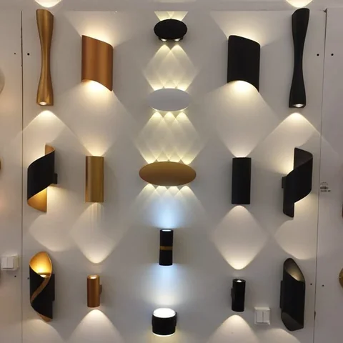 Up and down LED wall lights in black, gold and white finishes