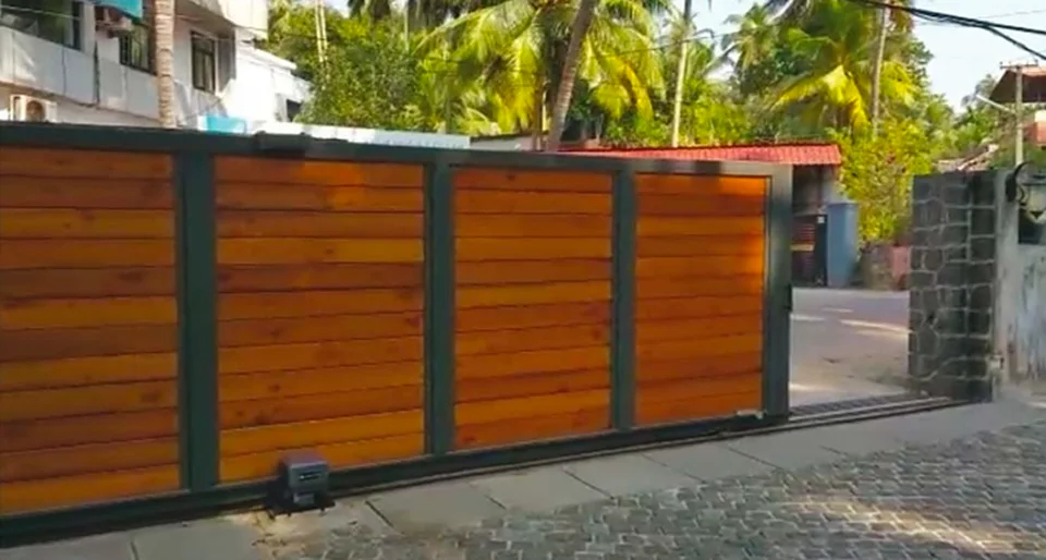 Elite Series automatic sliding gate with wood-finish slats and motor
